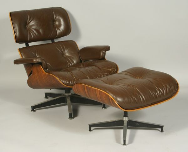 Herman Miller Rosewood Armchair & Ottoman: Herman Miller Rosewood armchair and ottoman with brown leather upholstery.