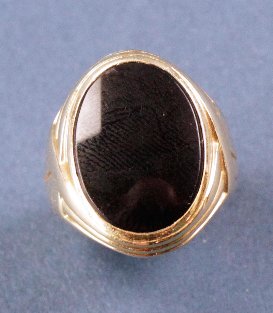 14k Yellow Gold and Onyx Ring: 14k yellow gold and onyx ring, approximately 12 grams TW. Provenance: West Palm Beach, Florida. (NOTICE: All jewelry including silver, gold, and silver items may only be paid for by Cash, Wire Transfe