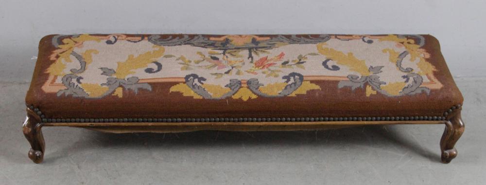 French Needlepoint Long Footstool: French needlepoint long footstool, 8" H x 40" W x 13" D. Provenance: Estate of August van der Becq, Westport, Connecticut.