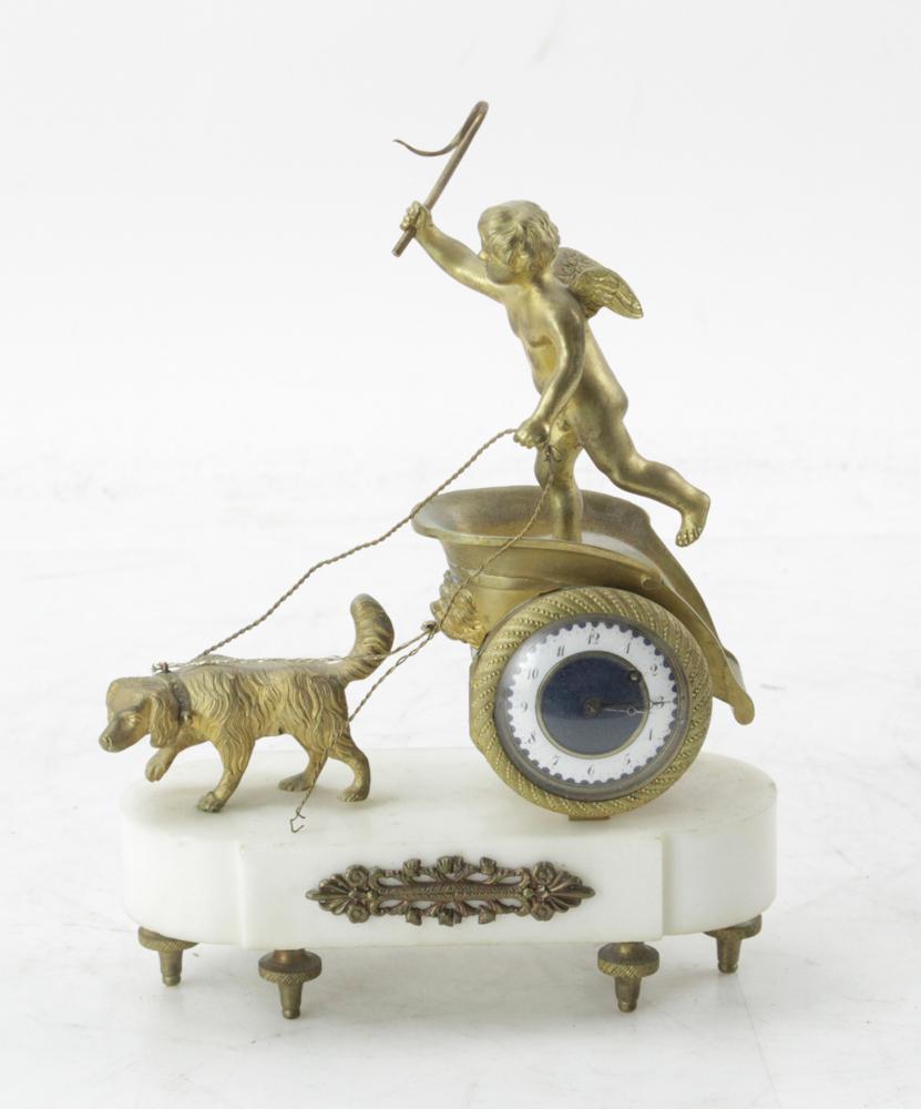 19thC French Gilt Bronze Chariot Clock: 19th century French gilt bronze chariot clock with white marble base, 9" H x 6" W x 3" D. Provenance: Estate of August van der Becq, Westport, Connecticut.