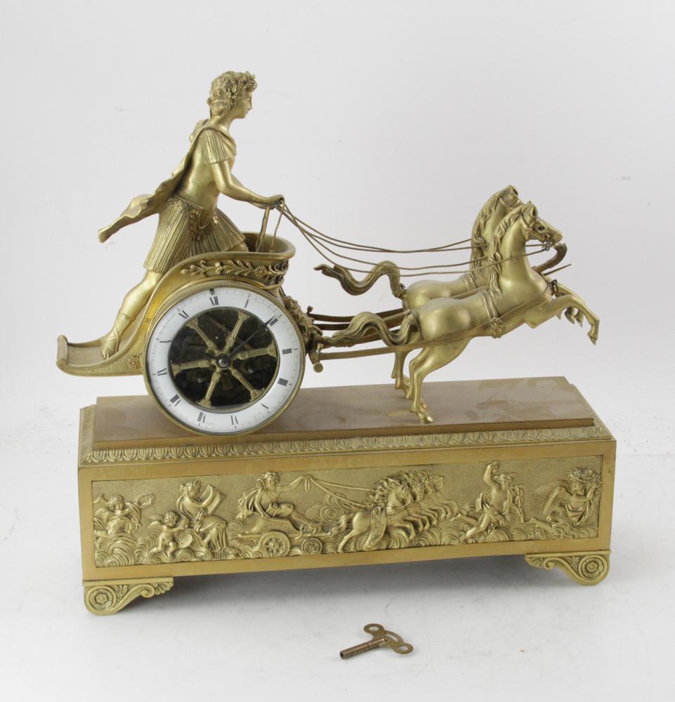 19thC French Ormolu Bronze Chariot Clock: 19th century French ormolu bronze chariot clock having silk thread, circa 1860, 18" H x 18" W x 5 1/4" D. Provenance: Estate of August van der Becq, Westport, Connecticut.