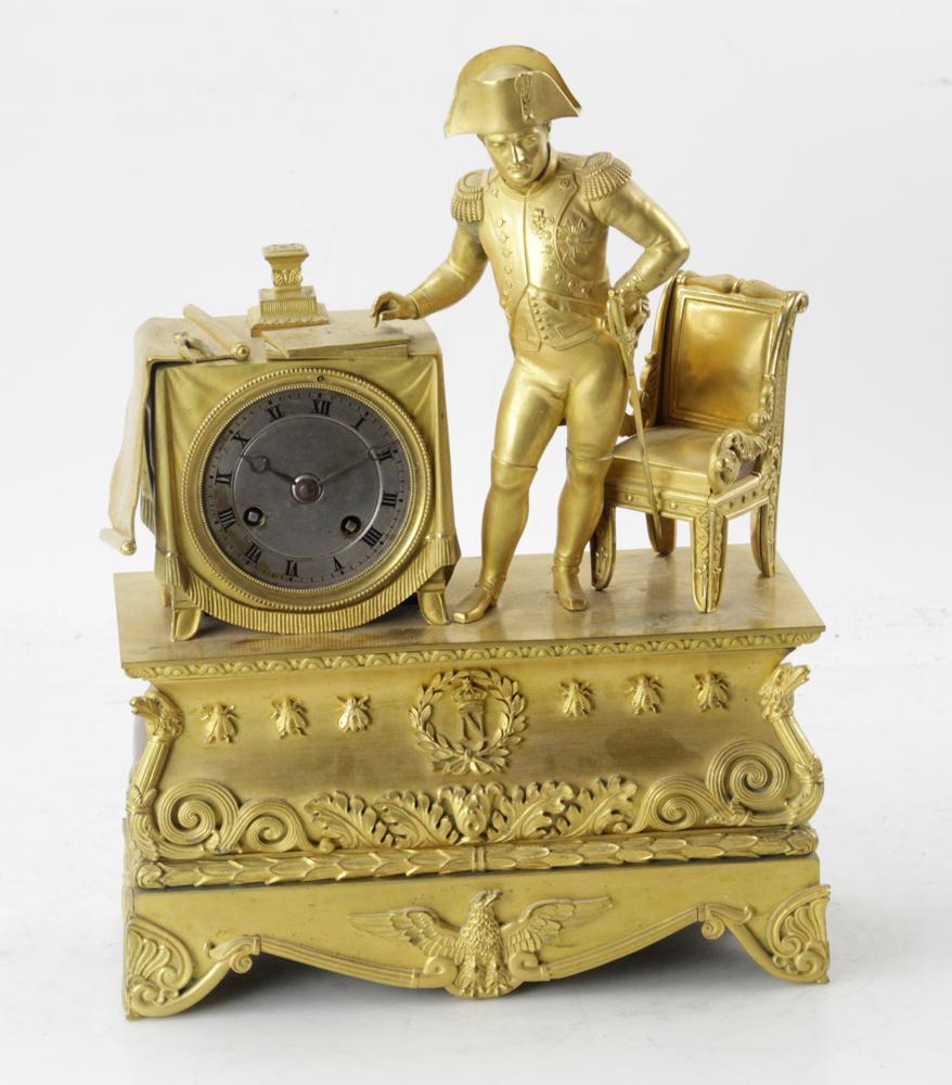 Early 19thC Napoleonic Clock: Early 19th century first period Napoleonic clock, having silk thread suspension, 14" H x 10 1/2" W x 4" D. Includes pendulum. Provenance: Estate of August van der Becq, Westport, Connecticut.