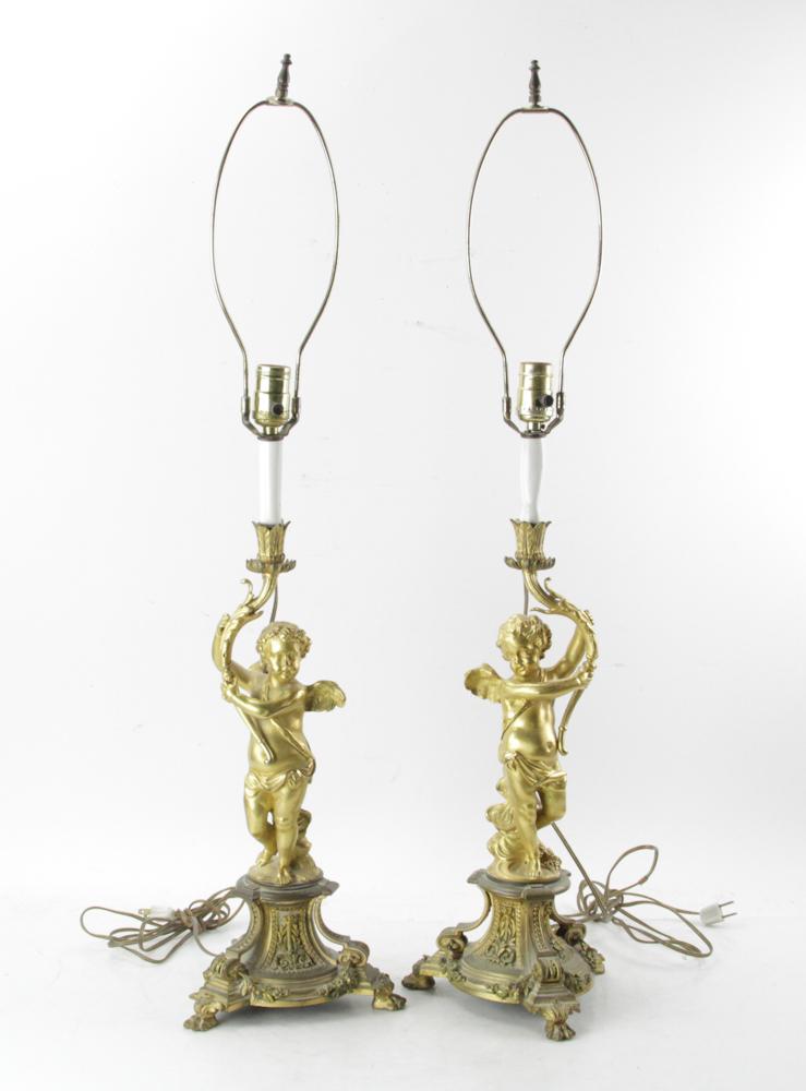 Pair of 19thC French Bronze Figural Cupid Lamps: Pair of 19th century French bronze figural cupid lamps, 35" H, candlestick height 18 1/2". Provenance: Estate of August van der Becq, Westport, Connecticut.