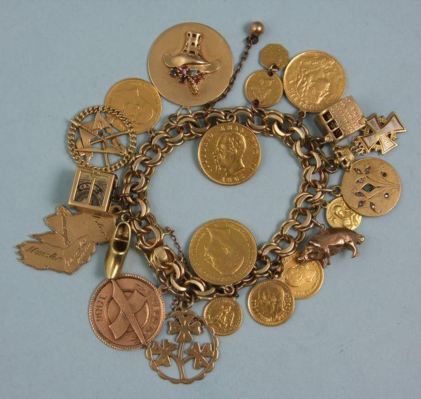 14KT Yellow Gold Charm Bracelet: 14kt yellow gold charm bracelet with twenty (20) gold charms including several gold coins (Duetsches Reich, 1908 20 Mark, 1852 U.S. one dollar, pesos, etc.), 3.6 oz/66 dwt t.w. Good condition.