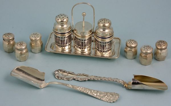 Lot of Sterling Silver Items: Lot of sterling silver items to include two (2) cheese scoops, three (3) salt and pepper sets, and a Dominik & Haff condiment tray with three receptacles having cobalt glass inserts, cheese scoops are