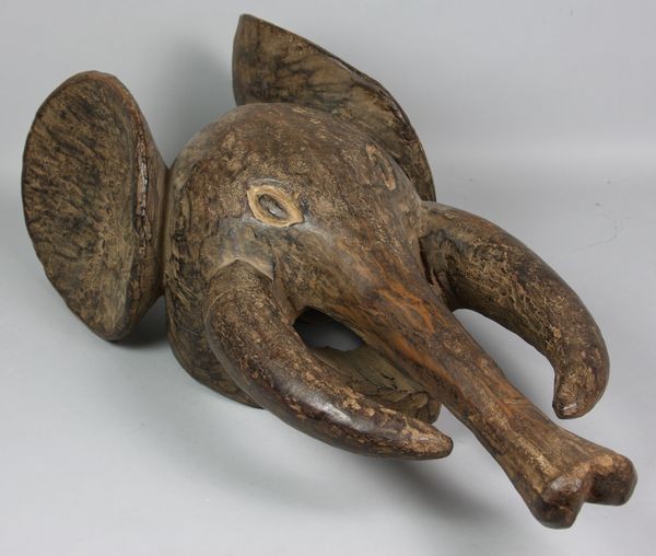 Mid 20th C. Elephant Mask: Mid 20th Century wooden elephant mask, 26"h x 10"w. Provenance: purchased in the late 1960/70s.