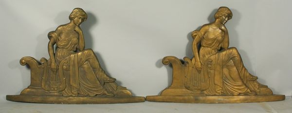 Pair of 1920s Building Ornaments: Pair of 1920s fiberglass, gold painted, building ornaments of classical women seating and playing the lyre, 38 1/4"h x 56 1/2"w. Good condition.