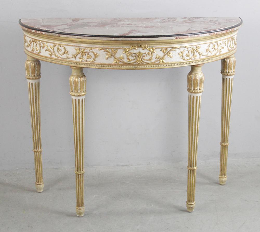 Italian Demilune Console with Marble Top: Italian demilune console having gilt and paint decoration with mutton fat marble top, with inlaid black marble band. Provenance: Estate of Robert Meyzen of Connecticut, co-founder of the legendary Fre