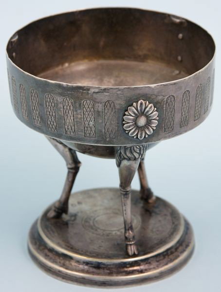 18th C. French Empire Silver Chalice: 18th Century French Empire silver chalice, tripod, goat feet, rosettes on body, hallmarked on base, 5"h x 4 1/2"dia. Minor surface abrasions and dents.