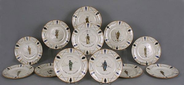 Twelve (12) 19th Century French Plates: Twelve (12) 19th Century French plates depicting military costumes from around the world, manufacturer's mark on bottoms, 9 1/8"dia. Crazing, two (2) with old staple repairs. Provenance: From the hist