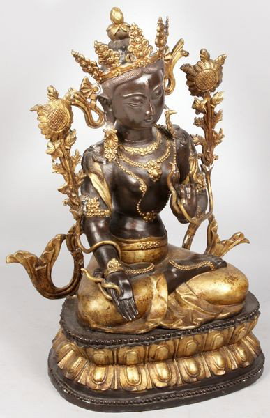 Chinese White Tara Female Buddha : Chinese White Tara female Buddha seated in lotus position, hands in mudra sign, flanked by utpala flowers, 26"h x 16"w x 12"d. Minor surface deposits.