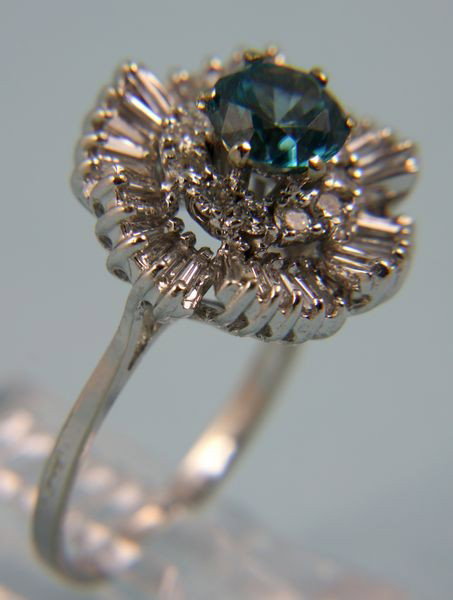 14K White Gold, Diamond, and Blue Zircon Ring: 14k white gold ring with 1 ct t.w. of diamonds and 6.5mm blue zircon, size 6, 0.1oz/3 dwt t.w. Good condition.