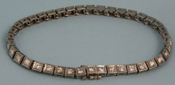 Platinum and Diamond Tennis Bracelet: Platinum and diamond tennis bracelet with forty (40) diamonds, 7 1/4"l, 0.5 oz/10 dwt t.w. Undamaged.