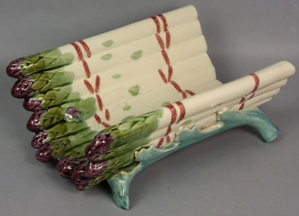19th C. Majolica Asparagus Server/Cradle: 19th C. French majolica asparagus server/cradle, 4"h x 10 1/2"w x 7 1/8" (across handles). One (1) interior bruise, minor 1/8" chip on underside.