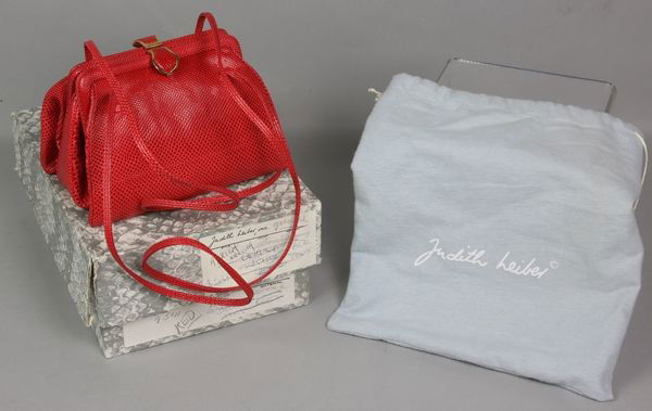 Judith Leiber Purse: Judith Leiber double sided reptile skin purse with change purse, mirror and comb, in original box, 7"w x 5"h. New condition.