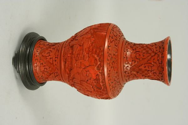 Late 19th/Early 20th C. Chinese Cinnabar Vase: Late 19th/early 20th Century Chinese cinnabar vase with wooden base, 9"h x 5"w.