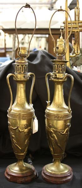 Pair of Brass Table Lamps: Pair of brass table lamps with classical motif, 23"h (to base of socket). As is; working condition not tested.