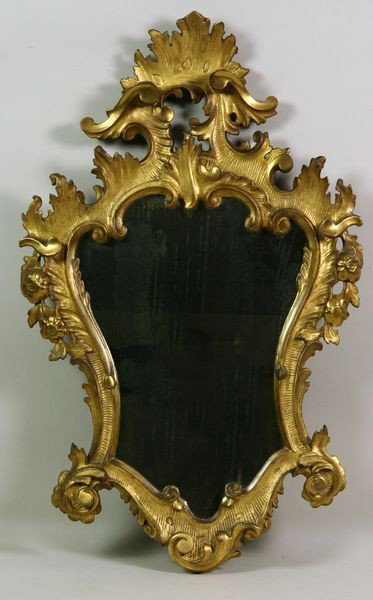Late 18th/Early 19th C. Gilt Mirror: Late 18th/early 19th century hand carved gilt mirror, 30"h x 19"w. Undamaged. Provenance: The items offered are from the Estate of RICHARD ALFRED CHAMBERS, MD. Dr. Chambers was born in 1923 at the fam
