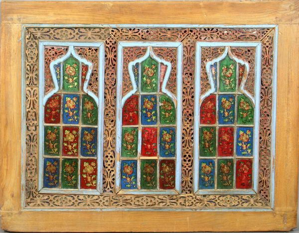 Late 19th/Early 20th C. Reverse Painted Glass Pan: Late 19th/early 20th Century reverse painted glass paneled window having carved wooden fret work, 29"h. x 37 1/2"w. Shiraz, Iran. Some paint loss.