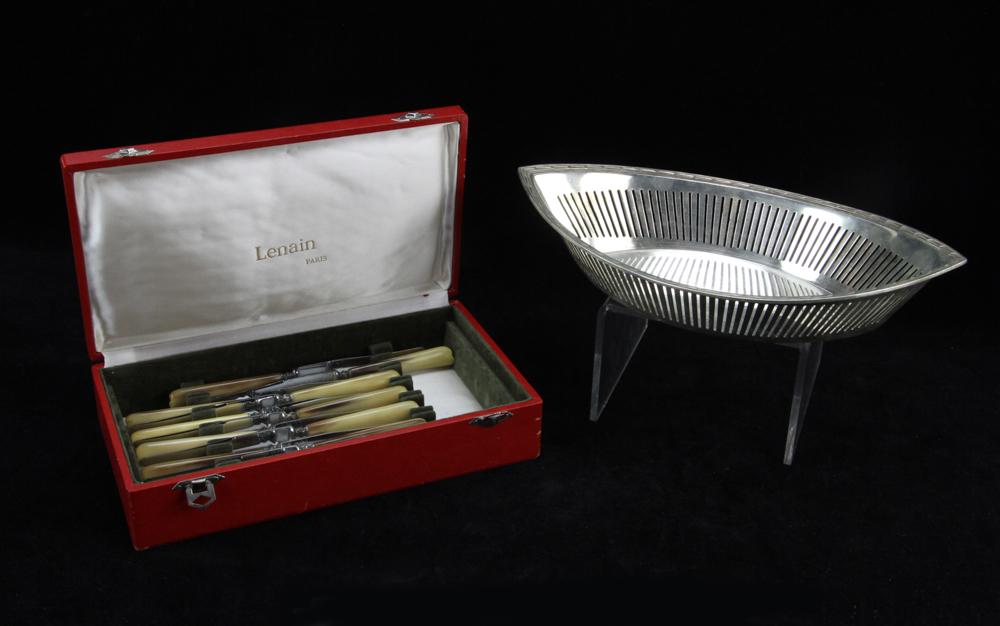 Christofle Silverplated Basket and Knives: Christofle silverplate reticulated basket, with twelve (12) Christofle Paris knives, basket 13". Provenance: From a California collector. PLEASE NOTE: payment for silver, gold, jewelry, and coins must