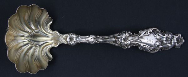 Whiting Sterling Silver Ladle: Whiting sterling silver ladle in Lilly pattern, marked "LA Piaget & Co. Sterling, PAT APP For", 3.5 troy oz t.w., 7 3/8"l. x 2 3/4"w.