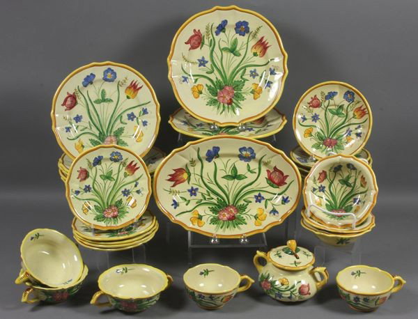Early 20th C. Italian "Tulipano" Dinnerware: Early 20th Century Italian "Tulipano" pattern dinnerware, partial set, including: (2) 9 3/4" plates, one chipped; (5) 8 3/4" plates, two chipped, one with hairline; (5) 6 3/8" saucers, four chipped; (
