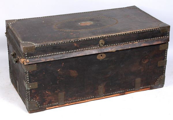 Chinese black leather bound camphorwood chest: Early-mid 19th Century Chinese black leather bound camphorwood chest having brass plates, handles, and tacks, 19 1/2" h. x 42" l. x 21 1/2" w., inscribed on plate 'Ida Kelly'.