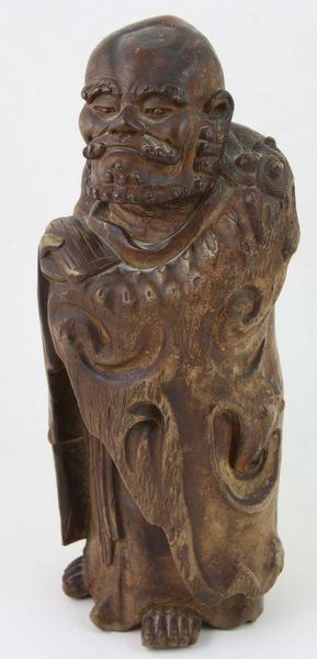 Bizen Ware Daruma: Bizen Ware Daruma, Japan, Edo period (1603 - 1868), 19th century, standing and wearing a cloak, heavily molded and finely crafted, 12 1/2" high.