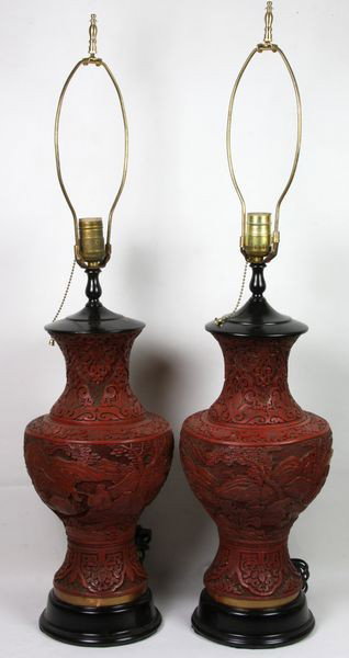 Pair of Cinnabar Lamps: Pair of Cinnabar Lamps, China, 19th century, vases carved with continuous landscapes around bodies and floral design on neck and near base, mounted as lamps, 33 1/2" high (overall) x 6 3/4" diameter (