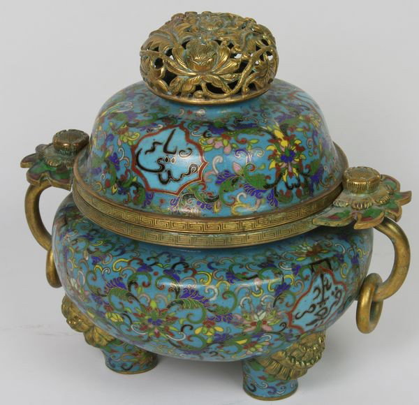 Cloisonné Censer: Cloisonné Censer, China, 19th century, enameled with flowers and four panels of Arabic writing in black, gilt rim, feet, floral finial, and flange handles with loose rings, on tripod feet, 6 1/4" hig