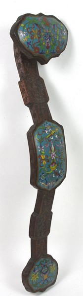 Carved Wood and Cloisonné Ruyi Scepter: Carved Wood and Cloisonné Ruyi Scepter, China, early 20th century, traditional form with carved wood body, three enameled faces with Daoist symbols, and lotus motif, 23" high, hairline crack on back.