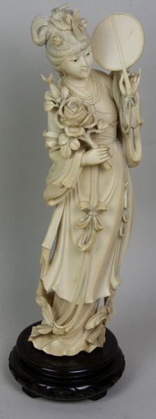Hand-Carved Ivory Figure of a Woman: Hand-Carved Ivory Figure of a Woman, China, 19th century, holding a mirror and flower, on wood stands, 13" high, undamaged.
