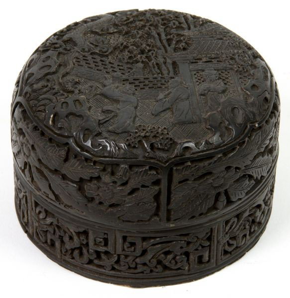 Cinnabar Ink Box: Cinnabar Ink Box, China, 19th century, with finely carved figures in a garden and floral relief around sides, 1 7/8" high x 3" wide, undamaged.