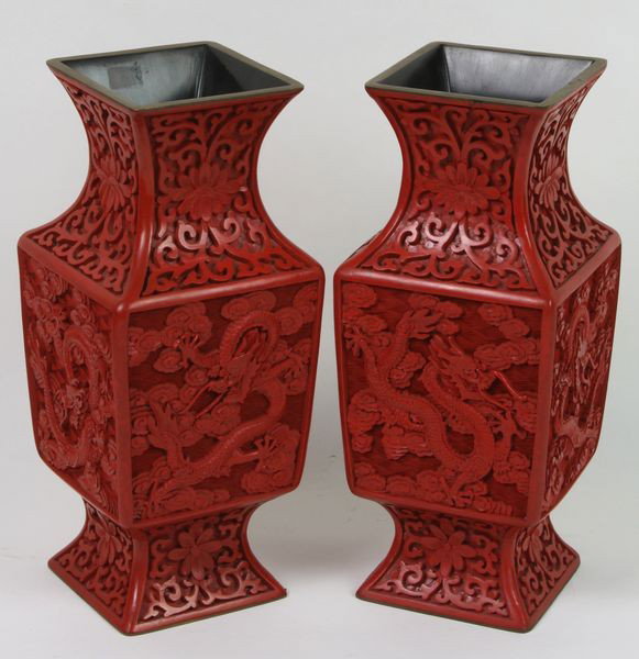 Pair of Cinnabar Vases: Pair of Cinnabar Vases, China, early 20th century, carved with dragons and clouds in relief, 9" high, undamaged.