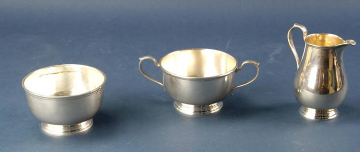Tiffany and Co. Sterling Sugar, Creamer, Bowl: Tiffany and Co. sterling sugar bowl, creamer, and waste bowl. Creamer 4 3/4" H, sugar bowl 6 3/4" (handle-to-handle), waste bowl 4 1/4" H. Approximately 19.3 troy oz TW. Provenance: Furnishings