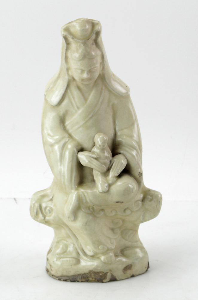Chinese Pottery Seated Guanyin, Ming Dynasty: Chinese pottery seated Guanyin with child, cream glaze, Ming Dynasty (16th century), 11" H. Provenance: Manchester, Massachusetts collection.