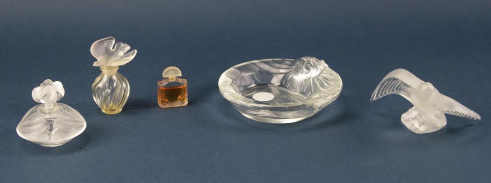 Lalique France Perfume, Ashtray, Martinet: Group of (3) Lalique France items, to include: perfume, 2 3/4" x 3"; ashtray with frosted lion head, 1 3/8" x 5 3/4" x 6"; frosted "martinet", 3" x 5" x 4". Good condition. Provenance: Toronto, Canada