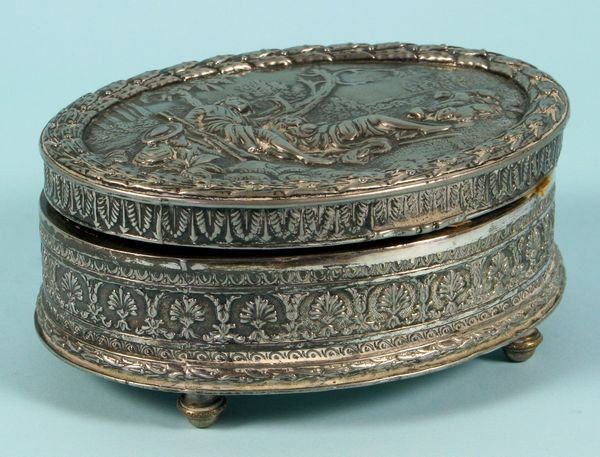 Late 19th/Early 20th C. Silver Plated Jewelry Box: Late 19th/early 20th Century Jennings Brothers silver plated jewelry box depicting woman, man and sheep in a field, marked on bottom "JB 2553", 2"h. x 5"w. Good condition.