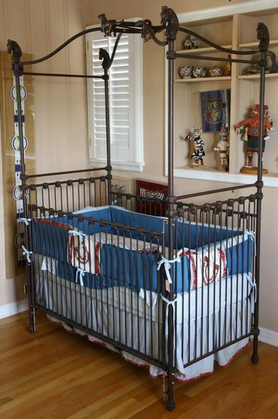 Cast Iron Corsican Crib: Cast iron Corsican crib with horse head finials at corners, 76 33/4" high x 53 1/2" wide x 29 1/2" deep, undamaged.