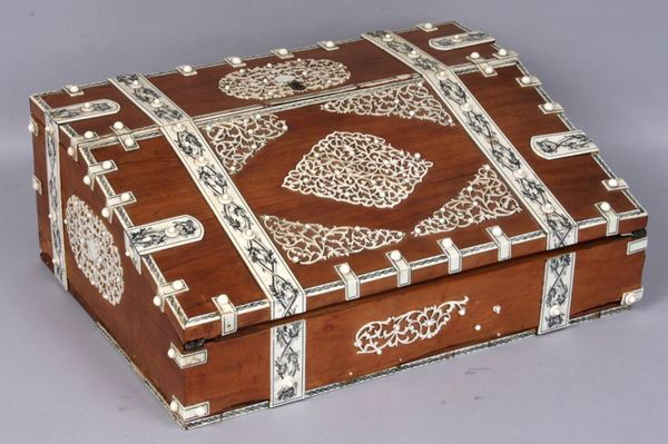 Early 19th C. Anglo-Indian lap-top desk: Early 19th Century Anglo-Indian lap-top desk having fine detailed ivory mounts, 4 1/2" h. x 12 1/4" w. x 9" d. Some ivory loss.