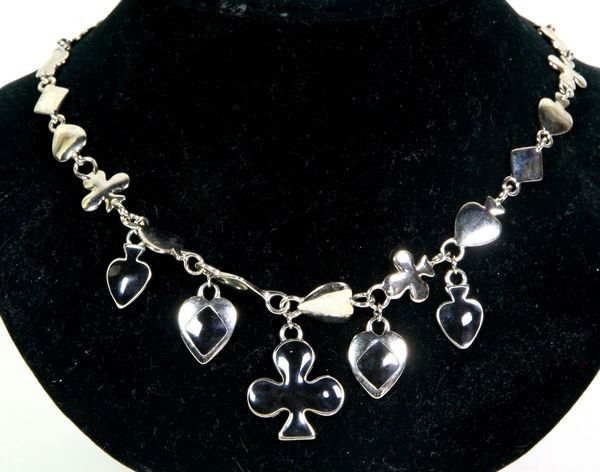 Trifari Necklace: Trifari silver metal necklace with playing card symbols and black enamel details, 20"l (overall).