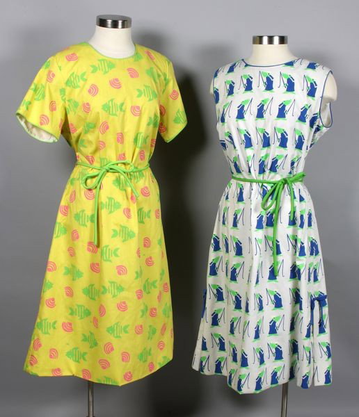 Two Vested Gentress Cotton Dresses: Lot of two (2) 1960s hand printed The Vested Gentress cotton dresses whimsical prints and belts, both approximate size large. Good condition.