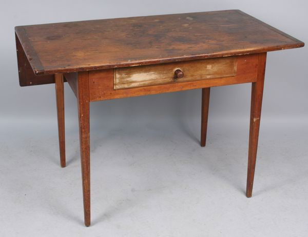 19th C. Tavern Table: 19th Century tavern table with one drawer and breadboard ends, 29"h x 44"w x 34 3/4"d (open). Fair condition.