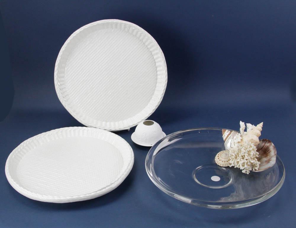 Este Ceramiche Platters, Glass Dish, Limoges Candle Holder: Two round Este Ceramiche Italian platters, basketweave pattern, for Tiffany & Co., 14 1/2"; clear glass serving dish with sea shells, 2" x 15"; Limoges Bernardaud covered candle holder, 3" x 4 1/2".