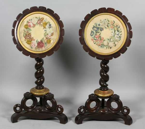 Pair of Tilt-Top Firescreens: Pair of small round tilt-top firescreens/side tables on spiral stems and Empire style bases, needlepoint inset roundels set between scalloped rims, 36"h x 16"dia. Needlepoint may be earlier than stem