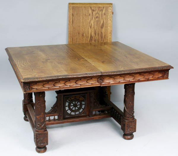 Late 19th C. Victorian carved oak dining table: Late 19th Century Victorian carved oak dining table with ship wheel design on base, 29"h. x 45"l. x 50"d, with an additional leaf, 45"l. x 20"w.