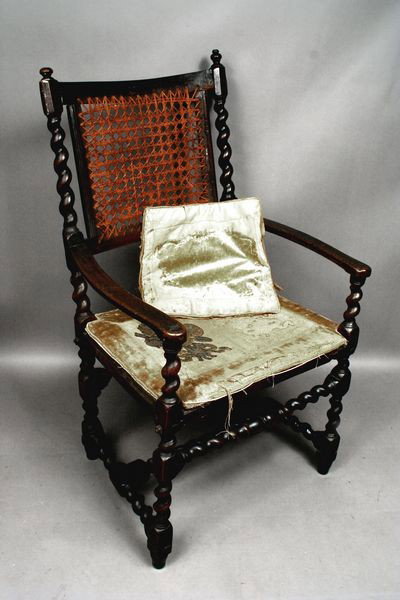 19th Century English Oak and Rattan Armchair: 19th Century English oak armchair with rattan seat and back, 41 1/2"h. x 25"w. x 17 1/2"d. Some minor worm damage.