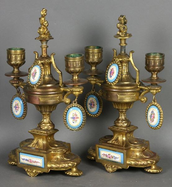Pair of 19/20th C. Sevres Ormolu Candlesticks: Pair of late 19th/early 20th Century Sevres ormolu bronzed white metal candlesticks, 10 1/4"h. x 6 1/2"w. Good condition.