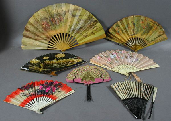 Seven (7) 19th C. Fans From Java, Cuba, France: Seven (7) 19th Century fans from Java, Cuba, and France, sandalwood, bone, etc., one marked "Offert Par Les Grand Magasins Au Bon Marche, Paris". Conditions vary.