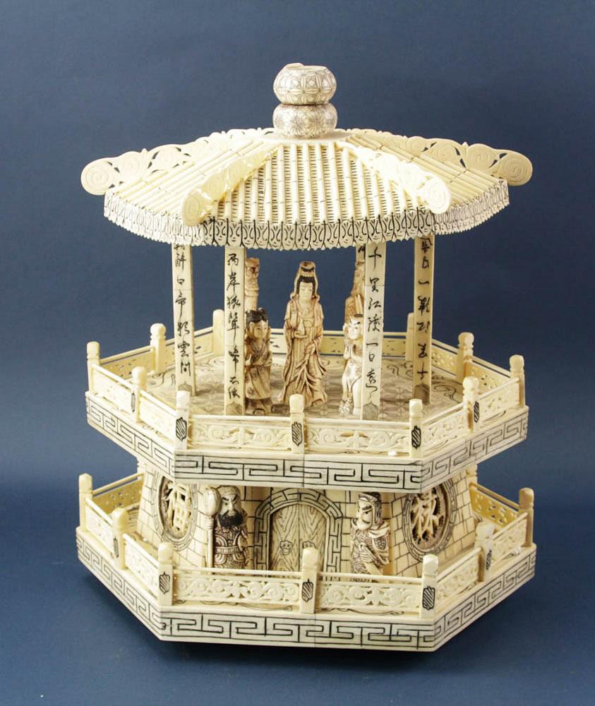 Chinese Carved Bone Sculpture of Pagoda: Chinese carved bone sculpture of a pagoda with people, approximately 22" H x 18" W x 13" D.